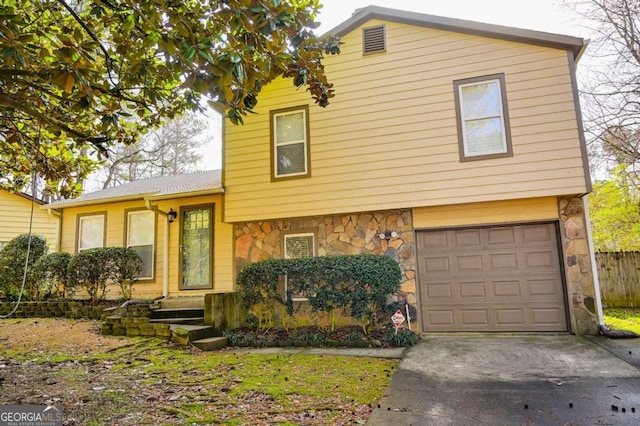 view of front of property featuring a garage