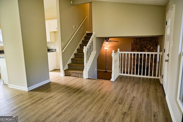 staircase featuring wood-type flooring