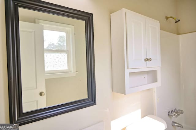 bathroom with shower / tub combination