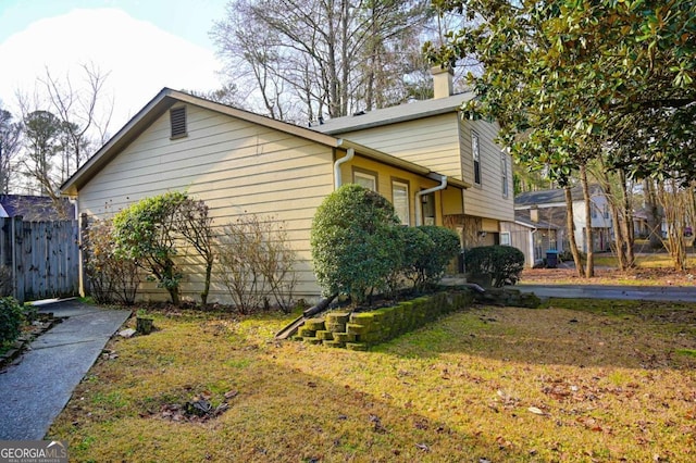 view of property exterior featuring a yard