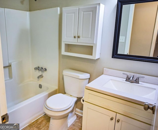 full bathroom featuring vanity, toilet, and  shower combination