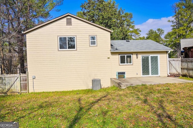 back of house featuring a yard and a patio area