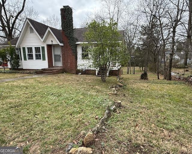 exterior space with a front lawn