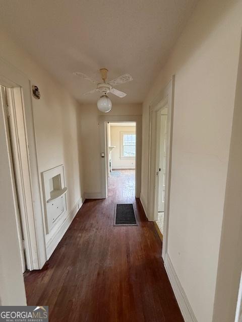 hallway featuring dark hardwood / wood-style floors