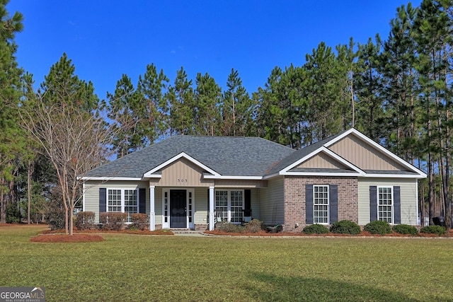 craftsman inspired home with a front yard