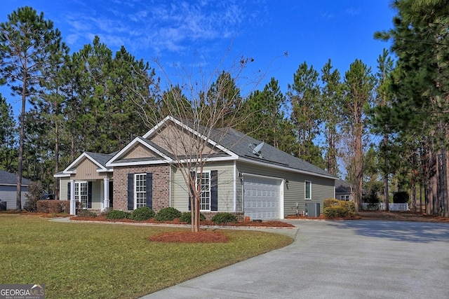 ranch-style house with a garage, central AC, and a front yard