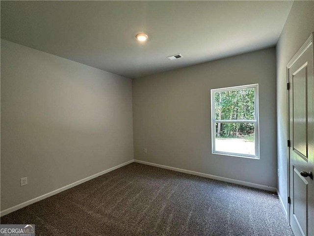 unfurnished room with carpet flooring