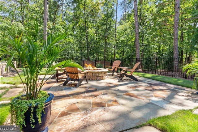 view of patio / terrace featuring an outdoor fire pit