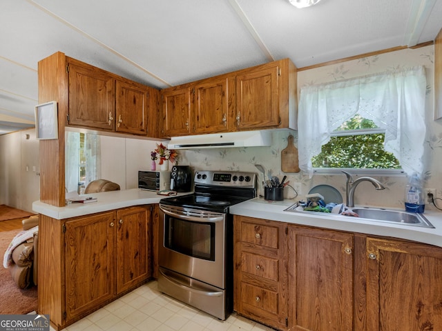 kitchen featuring vaulted ceiling, sink, and stainless steel electric range