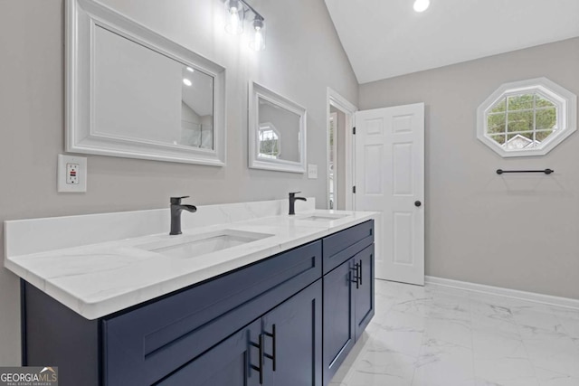 bathroom with vanity and vaulted ceiling