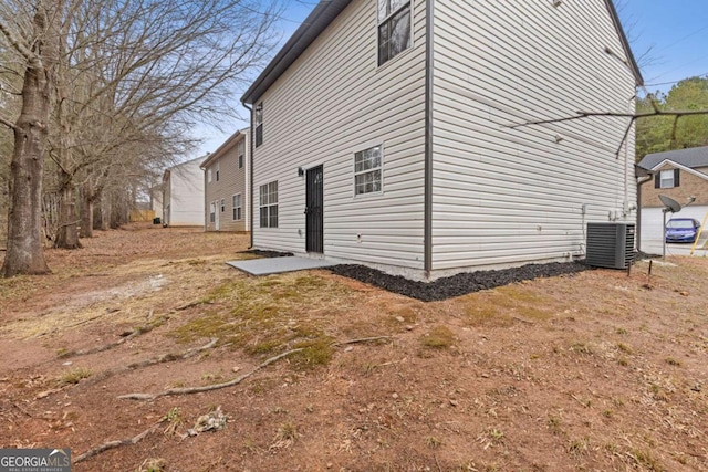 view of home's exterior featuring central AC and a patio area