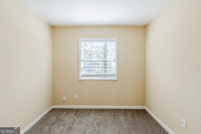 unfurnished room with light colored carpet