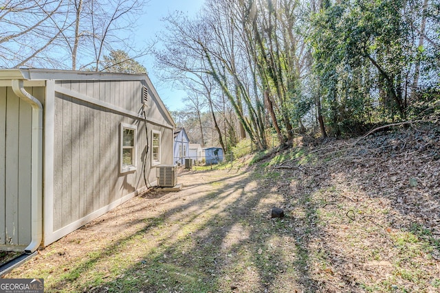 view of yard with central AC