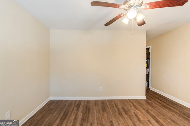 empty room with dark wood-type flooring and ceiling fan