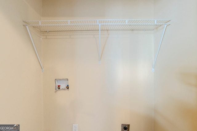 laundry area with washer hookup and hookup for an electric dryer