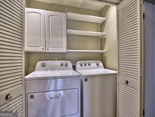 laundry area with cabinets and separate washer and dryer