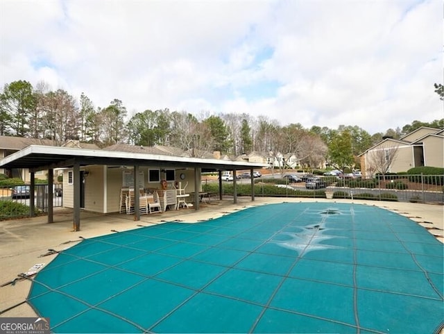 view of swimming pool featuring a patio area