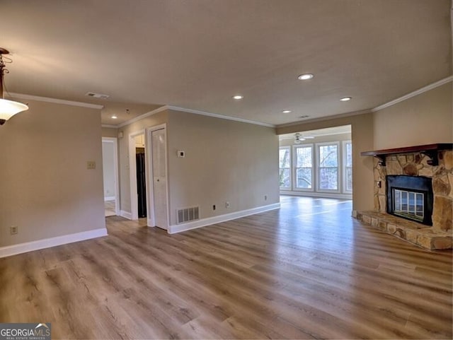 unfurnished living room featuring wood-type flooring and a fireplace