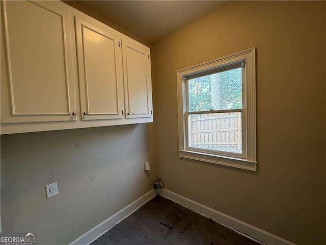 laundry room featuring cabinets