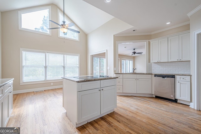 kitchen featuring stainless steel dishwasher, light wood-type flooring, a ceiling fan, and black electric cooktop