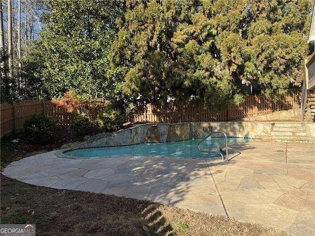 view of pool featuring a patio