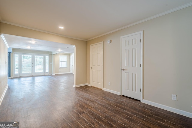 interior space featuring baseboards, crown molding, and dark wood finished floors