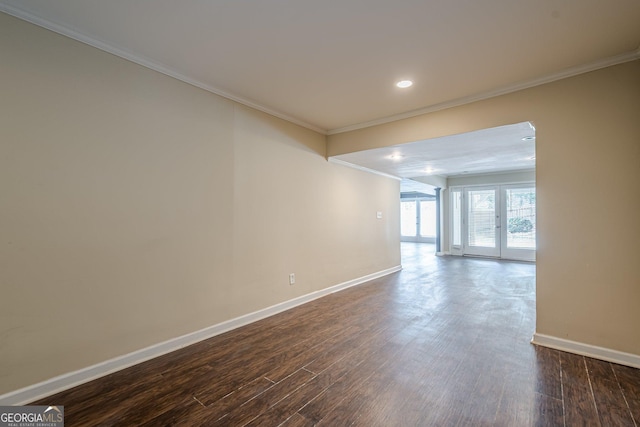 unfurnished room with crown molding, baseboards, recessed lighting, and dark wood-style flooring