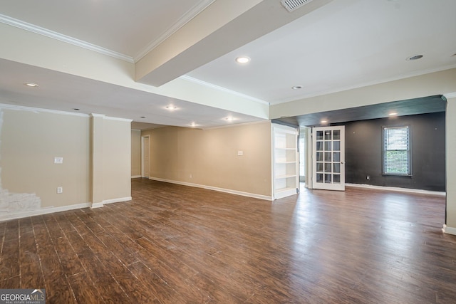 interior space featuring dark wood-style flooring, ornamental molding, and baseboards
