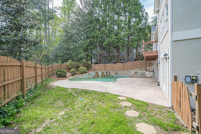 view of yard with a fenced backyard, stairway, a fenced in pool, and a patio