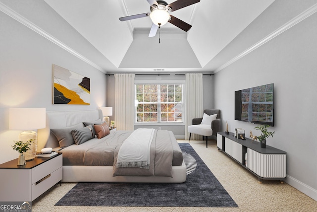 bedroom featuring light carpet, baseboards, a raised ceiling, a ceiling fan, and crown molding