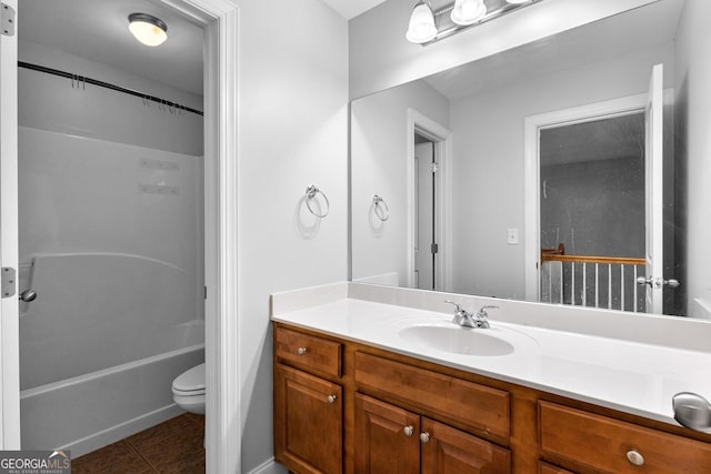 full bath with shower / washtub combination, vanity, toilet, and tile patterned floors