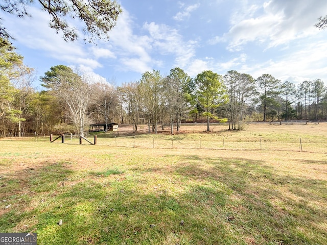 view of yard with a rural view