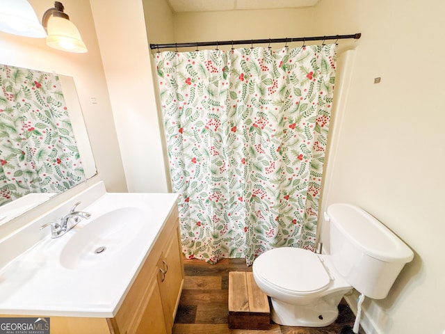 bathroom featuring hardwood / wood-style flooring, vanity, toilet, and a shower with shower curtain