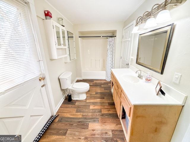 bathroom featuring vanity, a shower with curtain, wood-type flooring, and toilet