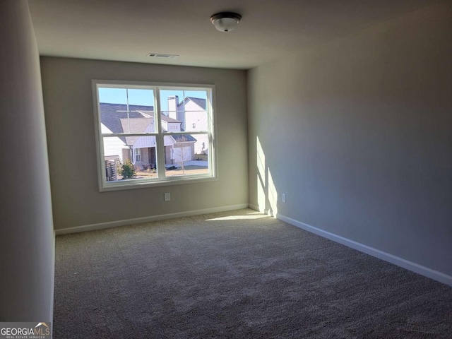 spare room with carpet flooring