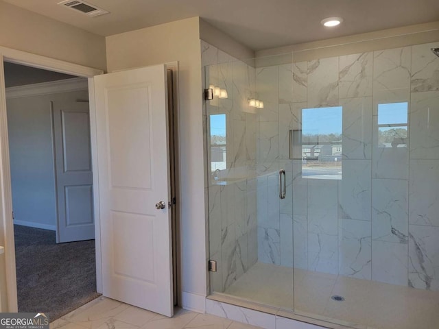 bathroom featuring an enclosed shower