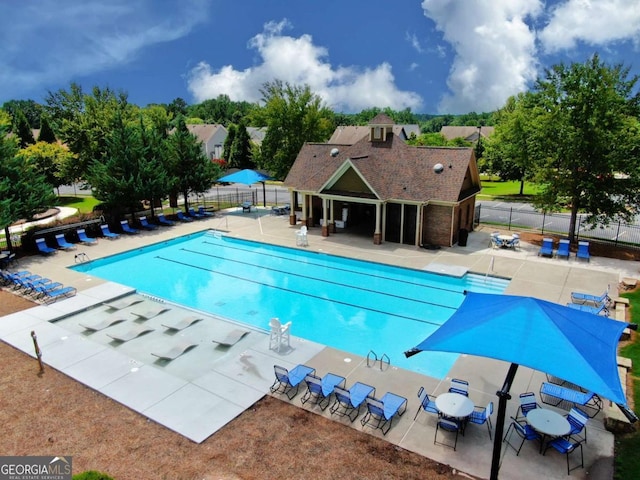 view of swimming pool featuring a patio area