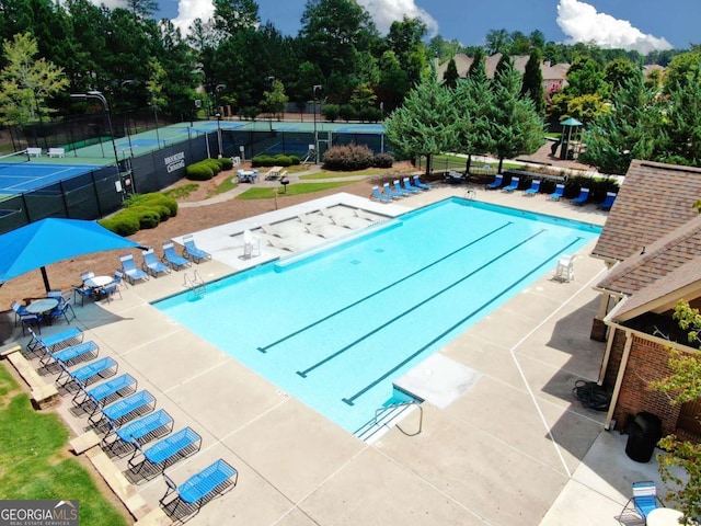 view of pool featuring a patio