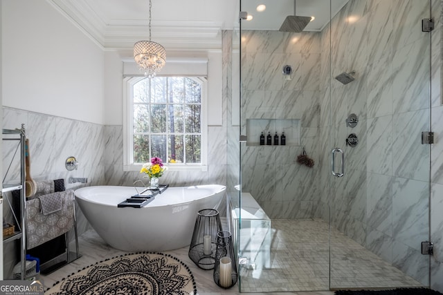 bathroom featuring ornamental molding, separate shower and tub, and tile walls