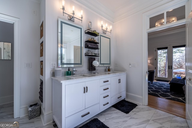 bathroom with crown molding, vanity, and french doors