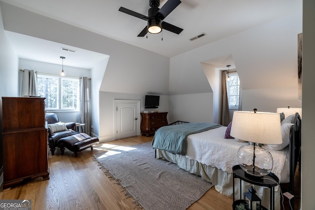 bedroom with ceiling fan and light wood-type flooring