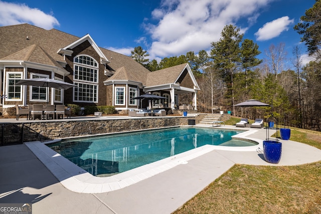 view of swimming pool with a patio area