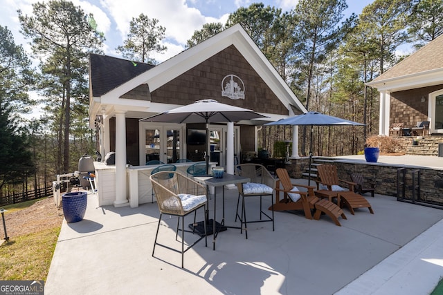 view of patio / terrace featuring french doors and an outdoor bar