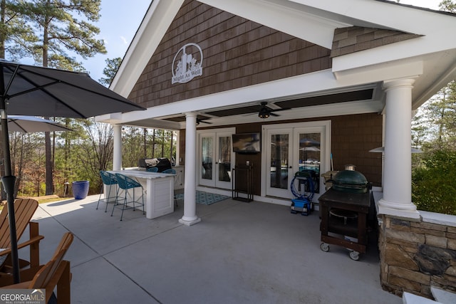 view of patio featuring french doors and ceiling fan