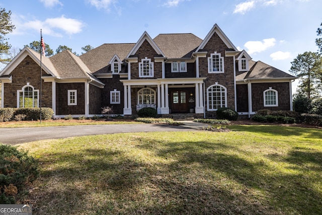 craftsman-style house with a front lawn