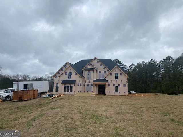 property in mid-construction featuring a front lawn