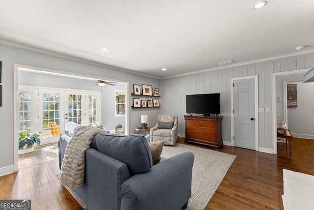 living room featuring french doors, ceiling fan, dark hardwood / wood-style flooring, and crown molding