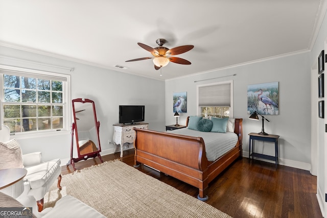 bedroom featuring crown molding, dark hardwood / wood-style floors, and ceiling fan