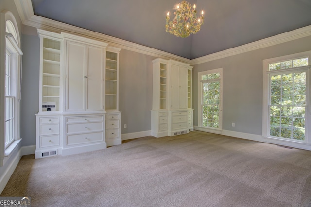 unfurnished bedroom with light carpet, crown molding, and a chandelier