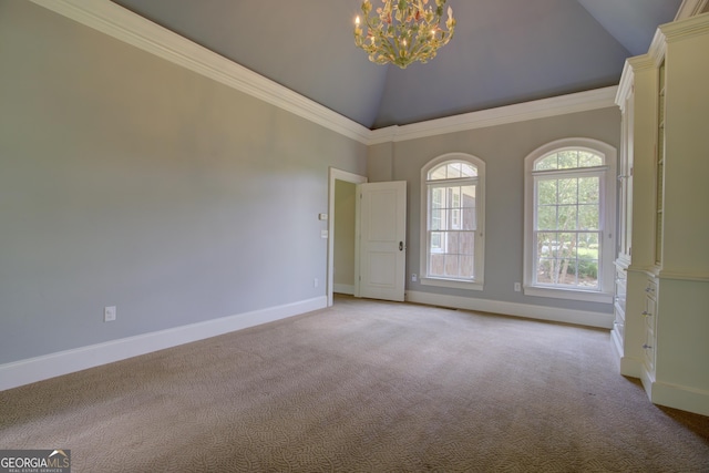 carpeted empty room featuring an inviting chandelier, ornamental molding, and high vaulted ceiling